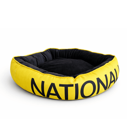 Cama National Geographic amarilla y negra con bordes elevados